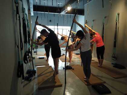 Stretching class with sticks at movement & Sports Medicine centre Singapore