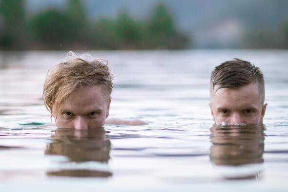 two guys doing Breathwork in water